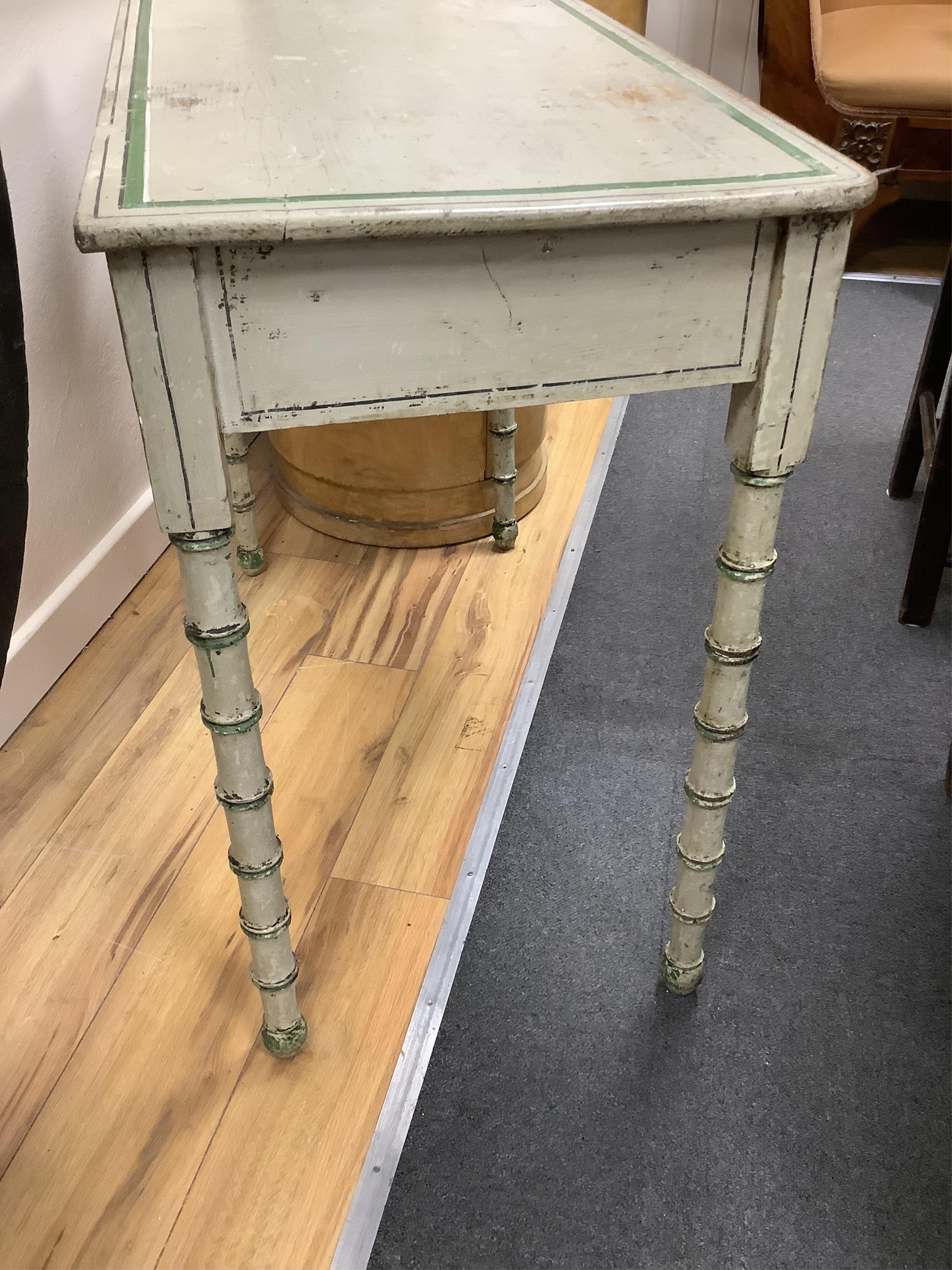 A Regency and later painted simulated bamboo side table in the manner of Colefax and Fowler, width 91cm, depth 44cm, height 78cm. Condition - fair
